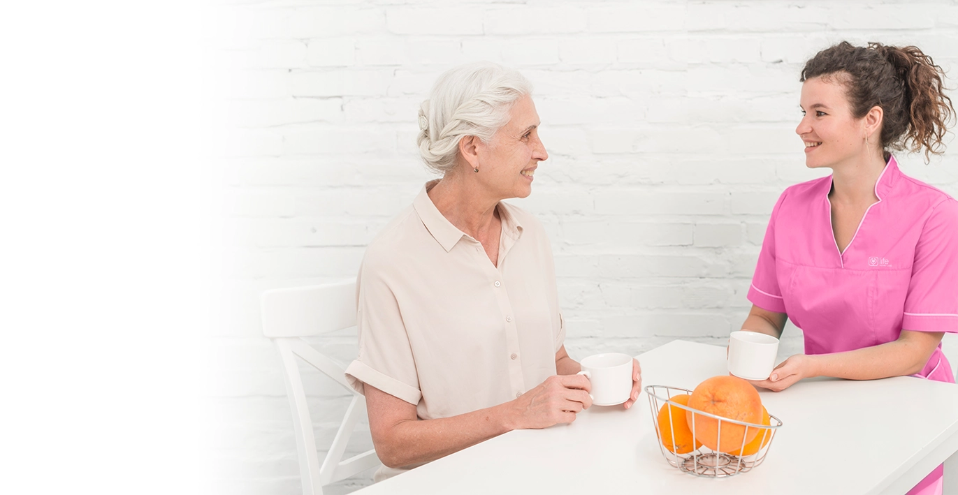 Nurse talking to an elderly person