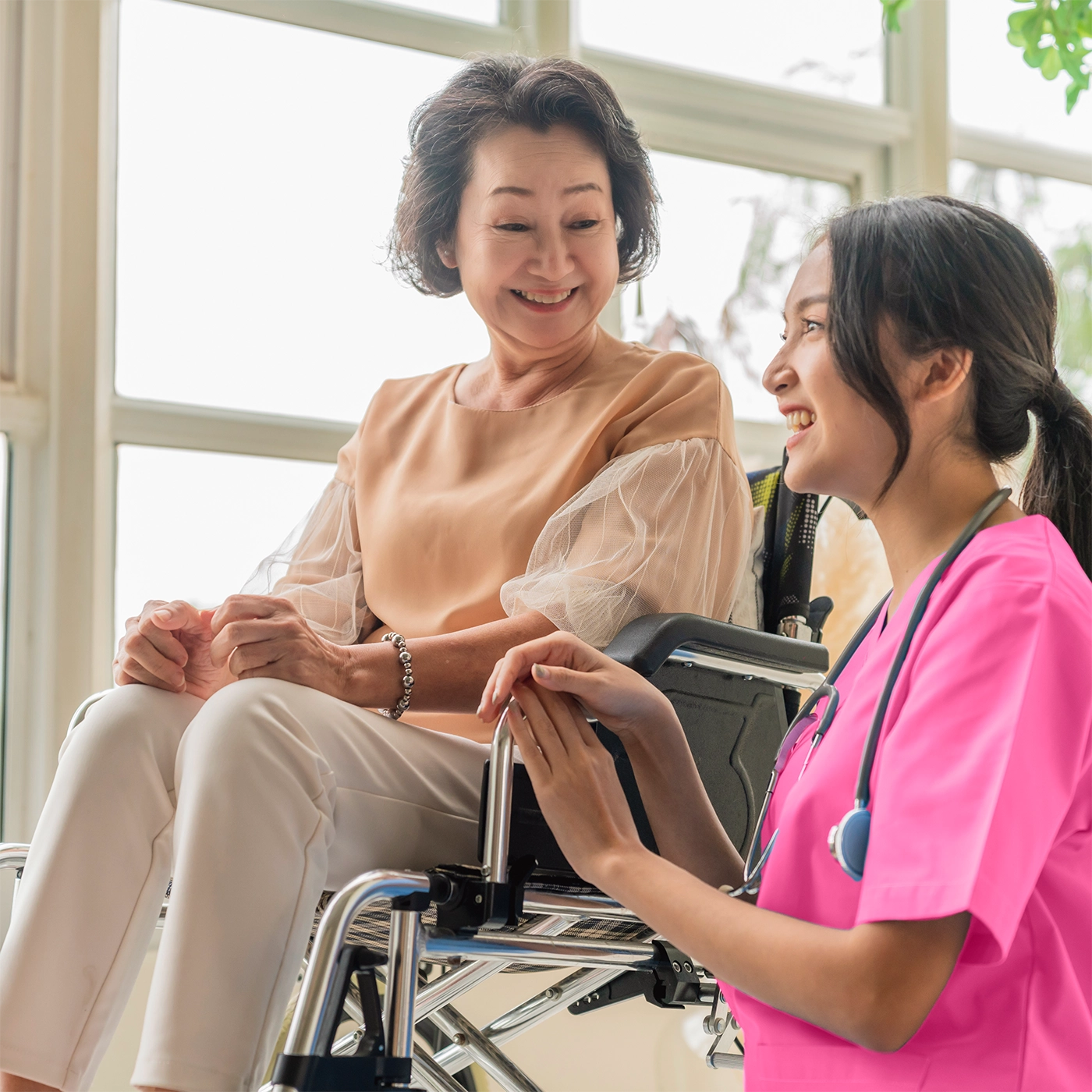 Nurse smiling with elderly person
